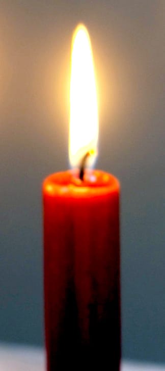 A lit brown candle