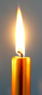 A lit gold candle