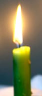 A lit green candle