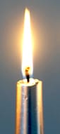 A lit silver candle